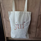 Canvas tas met geborduurde tekst in bloemen "Juf"