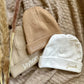 Newborn muts met naam (verschillende kleuren)